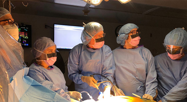Image of doctors performing surgery