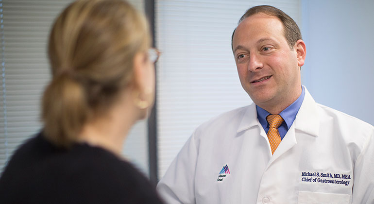 Dr. Michael Smith meets with a patient about her GERD