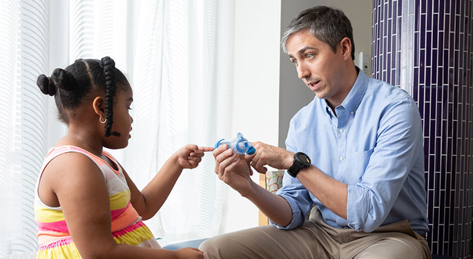 Doctor playing with child