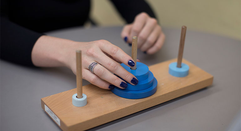 Woman playing with wooden blocks