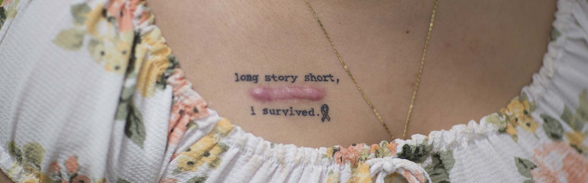 Long Story Short, I Survived Tattoo on chest above scar on a Female