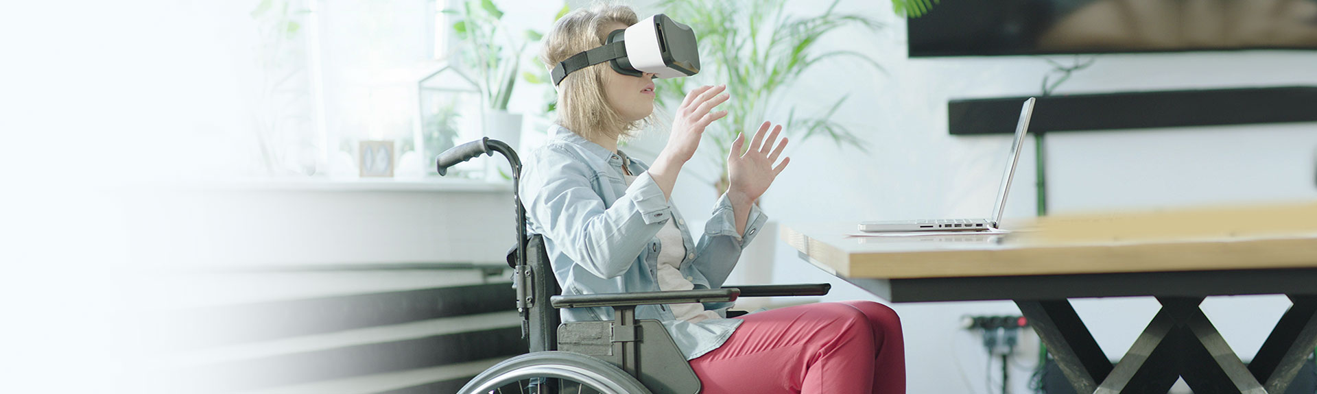 woman in wheel chair with VR glasses on
