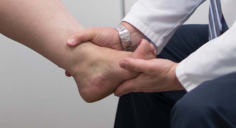 doctor examining a patient’s foot