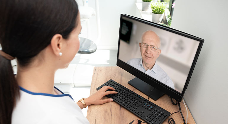 Woman using computer for telemedicine appointment