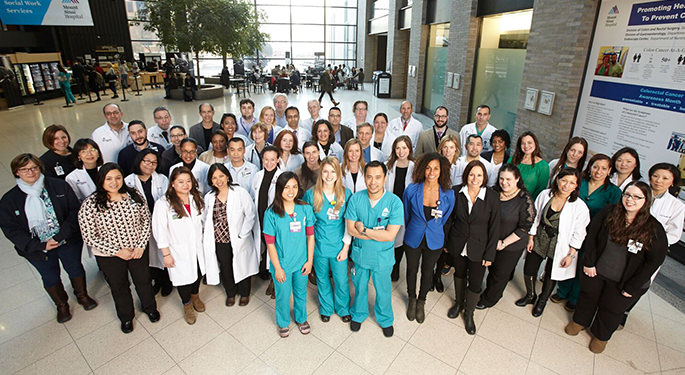 Image of doctors, staff, nurses at The Recanati/Miller Transplantation Institute in the lobby