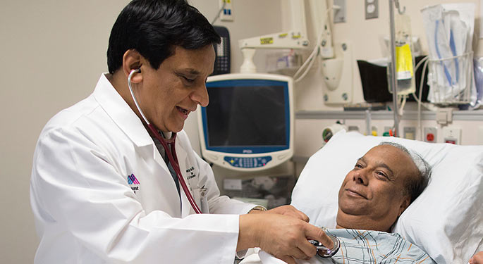 Image of Dr. Samin Sharma with patient