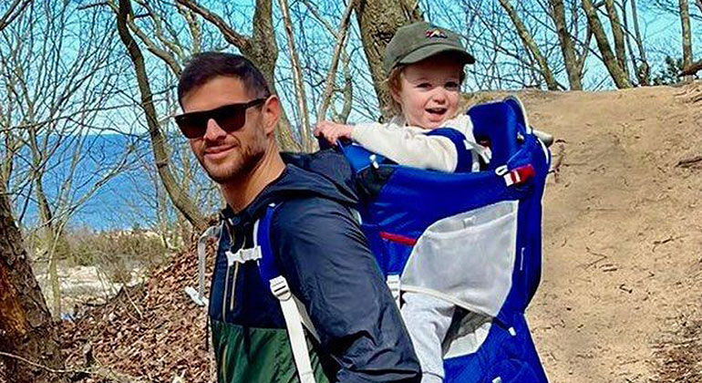 Matias Escobar on a walk outdoors with child