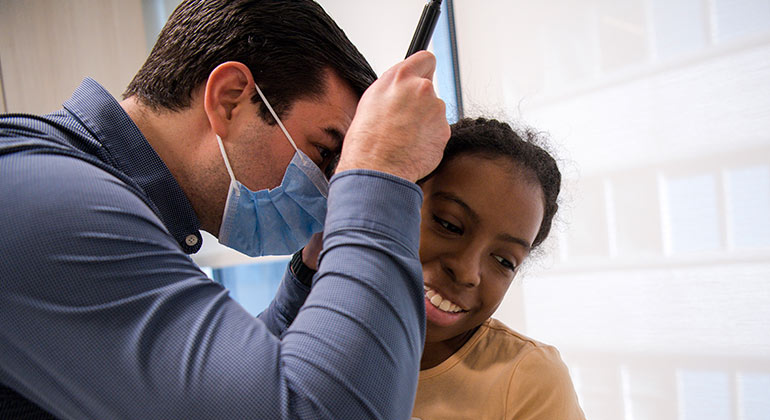 doctor checking patient