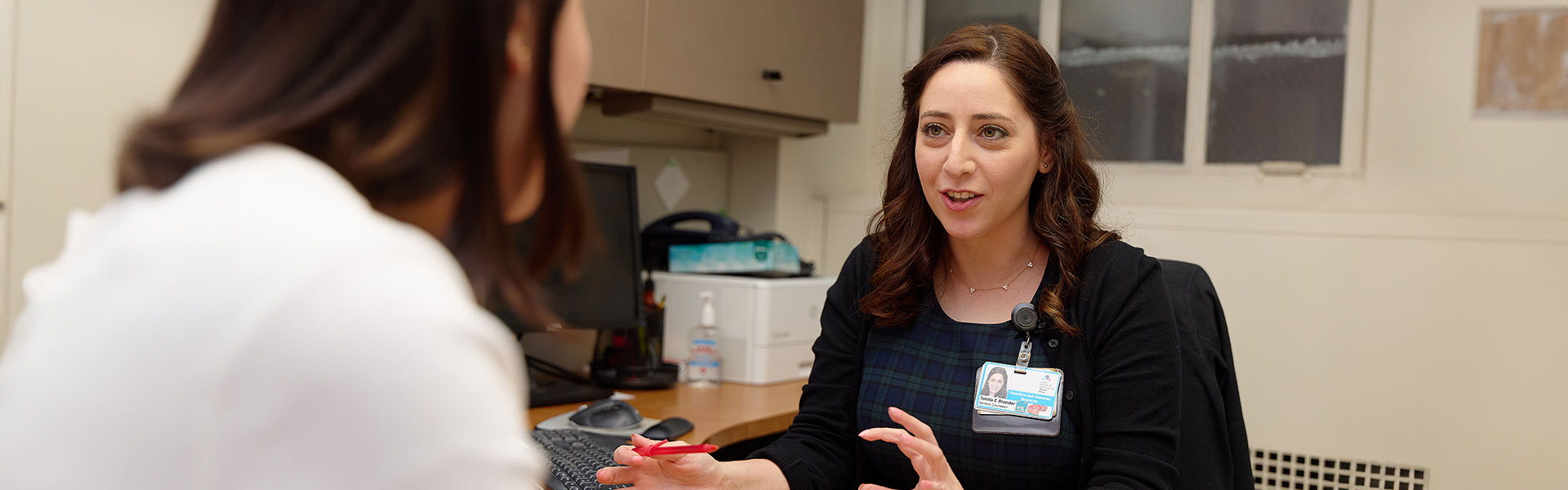 doctor speaking to patient in office