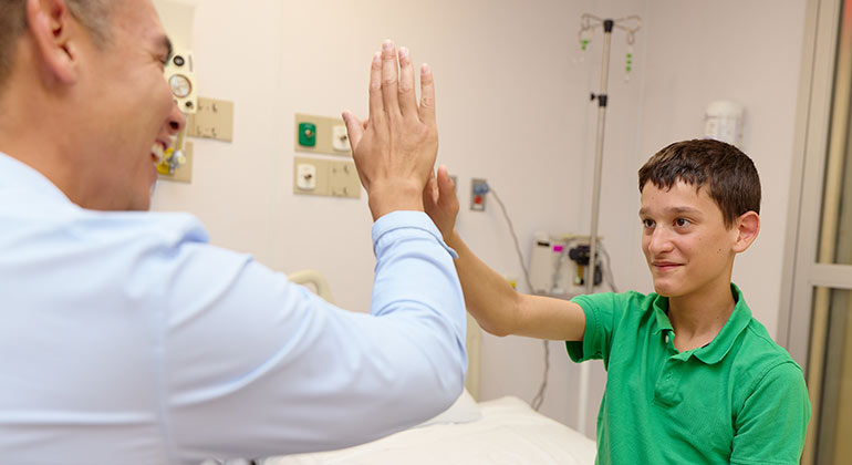 child performing a test with doctor