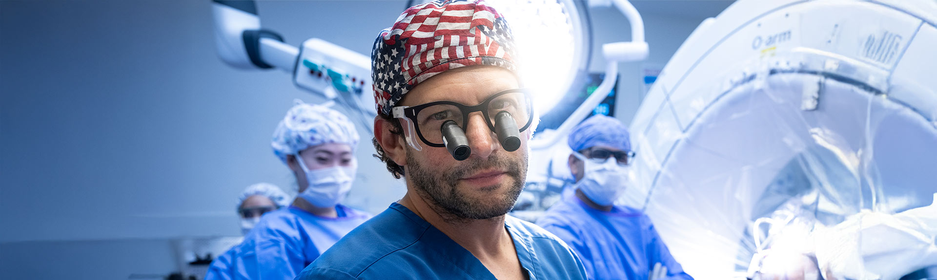 neurosurgeon with team and patient in background