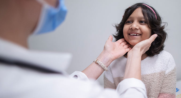 doctor checking pediatrics patient