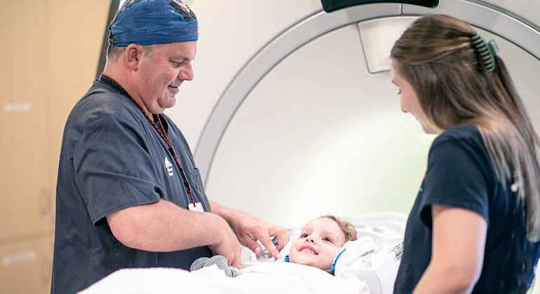 Image of doctors with child patient