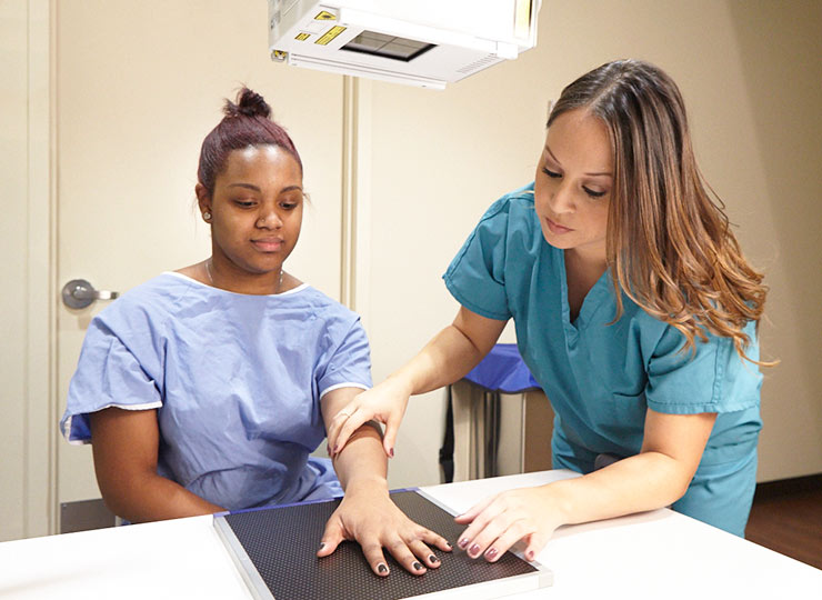 Photo of doctor examining patient's hand