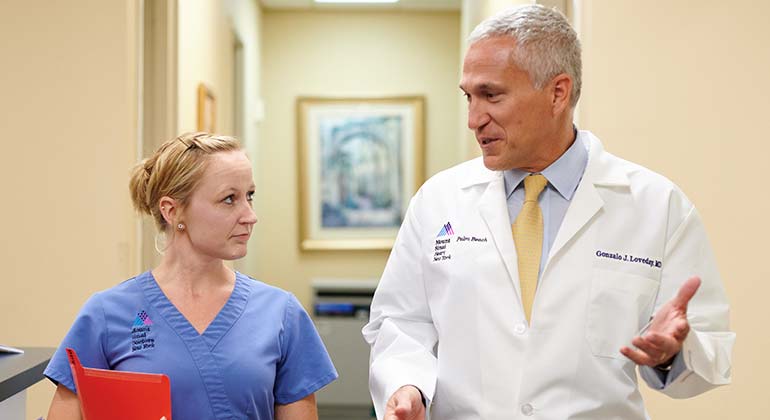 Image of doctor and nurse talking