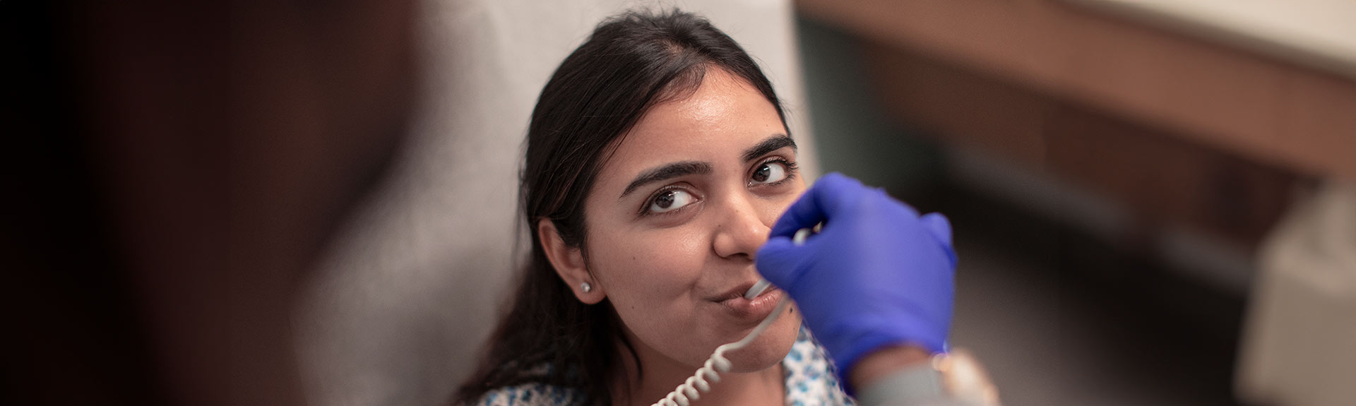 image of doctor taking patient