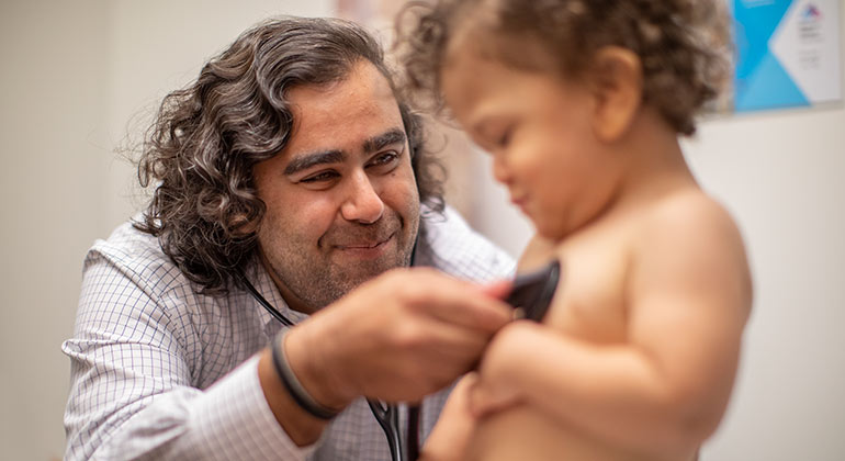 doctor caring for a pediatric patient