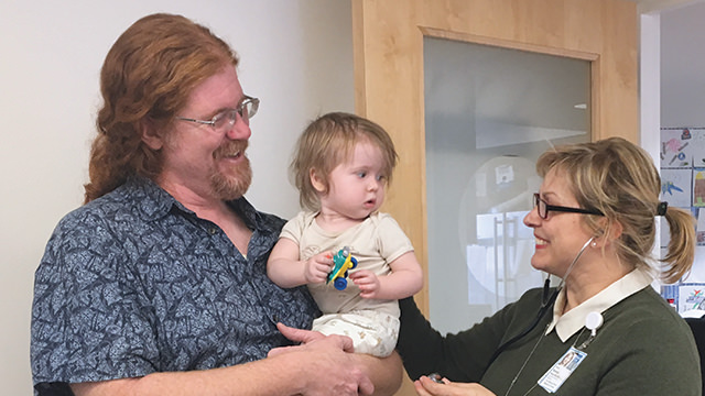 Parents holding baby