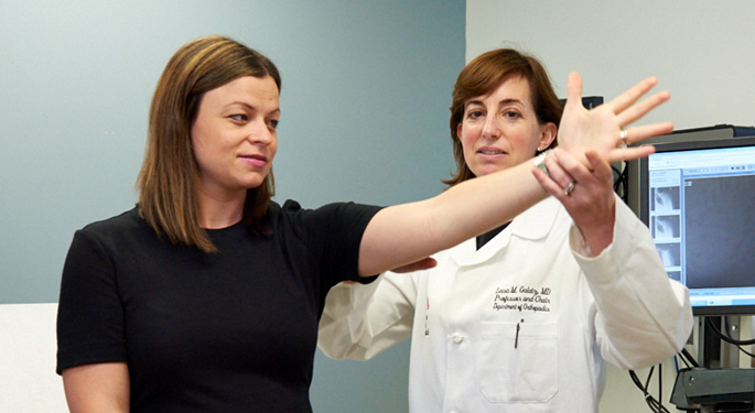 Image of orthopedic surgeon and system chair, Dr. Leesa Galatz with female shoulder patient.